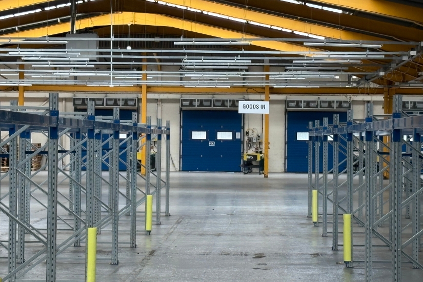 Warehouse clearance in progress—forklifts, pallet racking and conveyors prepared for auction